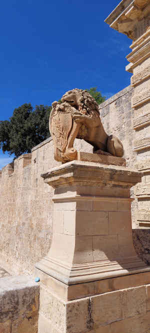 Mdina; city gate; stone lions; Malta